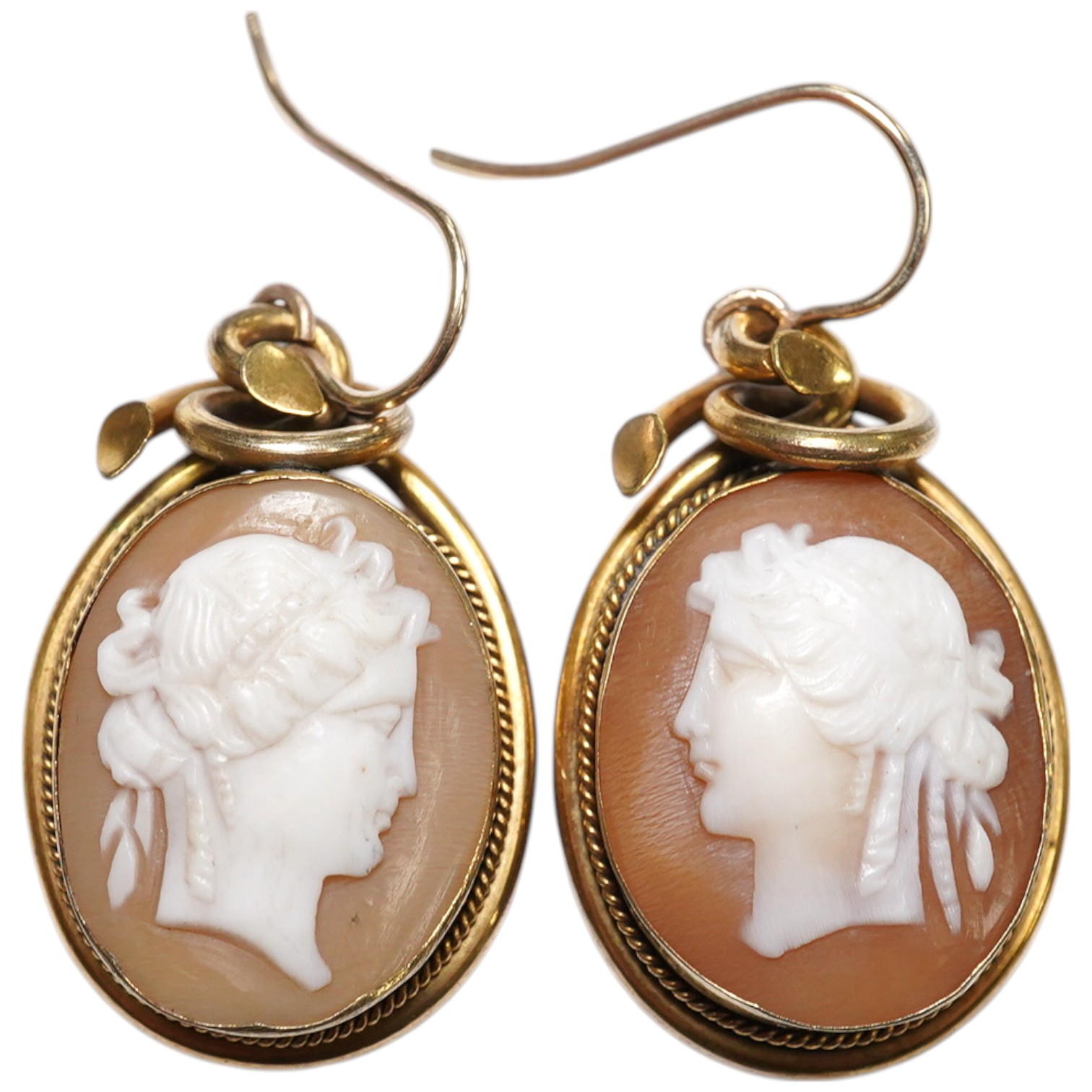 A pair of yellow metal mounted oval cameo shell drop earrings, carved with head of a lady to dexter or sinister, shell approx. 20mm. Condition - fair